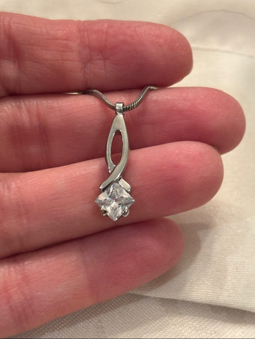 Elegant Silver Infinity Pendant Necklace with Clear Stone